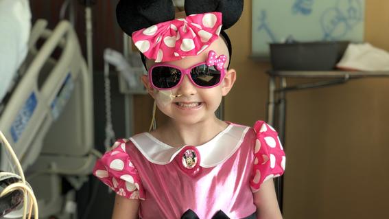 Alina dressed up as Minnie Mouse for Halloween during treatment in October of 2020.