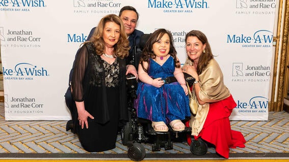 Wish alum and wish ambassador Isabel Bueso (center) with her parents, Karla and Alberto Bueso, and CEO Betsy Biern 