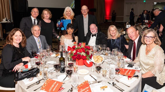 Scott and Lucia Gilbertson, our Ruby Jubilee Sponsor, with their guests at 2024 Evening of Wishes: Birthday Bash. 