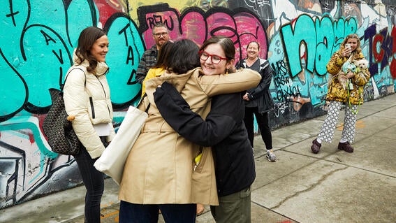 Josie and Colossal Team hugging
