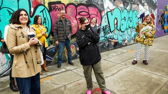 Josie looking at her mural