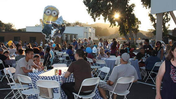 Wish families enjoying diner donated by Mary's Pizza Shack during the wish celebration 