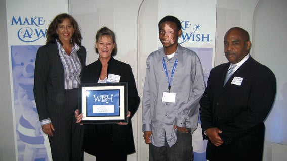 Aaron with Make-A-Wish staff in 2009
