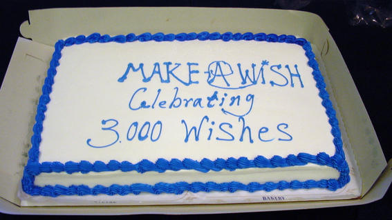 A sheet cake that says "Make-A-Wish celebrates 3,000 wishes"