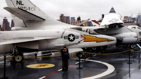 Matthew in front of planes at the Intrepid Air and Space Museum