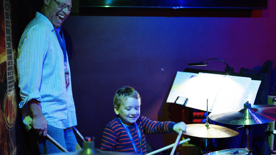 Nolan rocking out on the drums during his wish celebration.