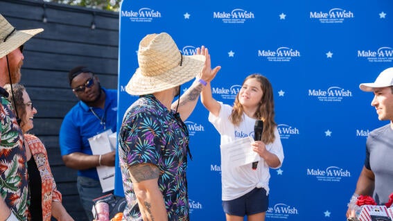 Pickleball for Wishes wish kid high five