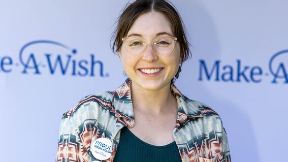 Wish It Forward council member and wish alum Lena, who wished to swim with dolphins in 2008.
