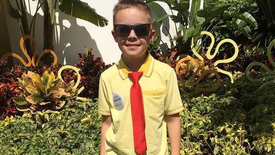 Waylon dressed in his SpongeBob SquarePants outfit outside his Pineapple Villa