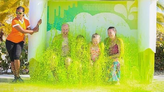 Waylon, his sister Billie Bea, and Waylon’s parents, Todd and Stacy, getting slimed on Waylon's wish to go to the Nickelodeon Resort in 2019.