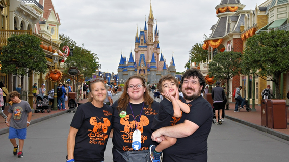 Elliott with his family at Magic Kingdom