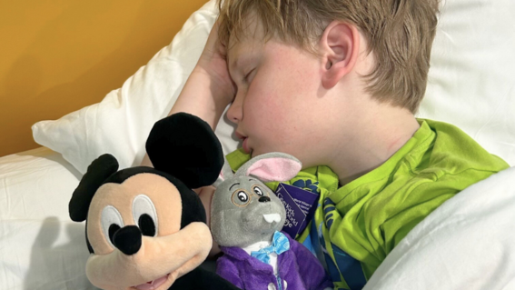 Aaron asleep with mickey