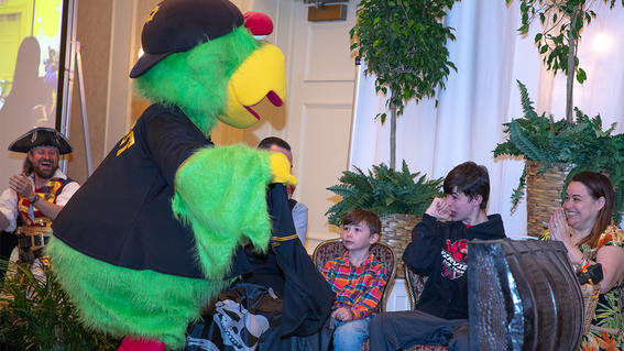 Gabe pleasantly surprised to see the Pirate Parrot on stage with him and his family.