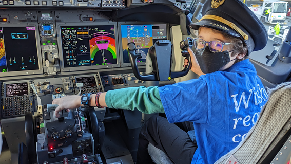 Rhydian in the cockpit of United Airlines before his flight to Hawaii to see waterfalls.