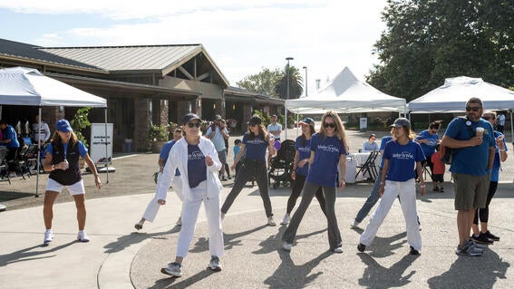Adults dancing at post-Walk festivities