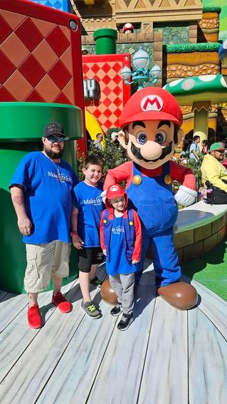 Sammy and family with Mario
