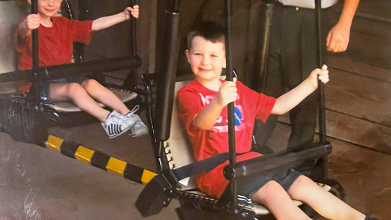 Ethan Hite on a ride with brother at Walt Disney World