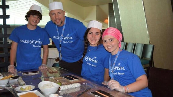 Elizabeth and family taking cooking class