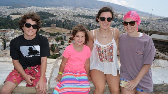 Elizabeth and family at scenic overlook in Greece