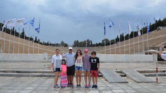Elizabeth and family at Olympic village in Greece