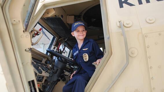 Nathan, 6, got to wear a uniform, drive fast in cars, ride in a helicopter!