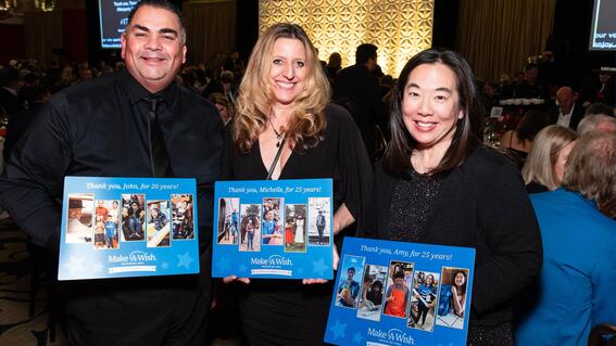 John Villanueva with volunteers Michelle Garnett (center) and Amy Crandall (right)
