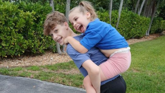 Oakley Piggyback Ride with Brother