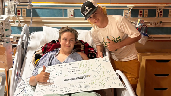 Stephen's teammates brought a poster to the hospital to help him fight.