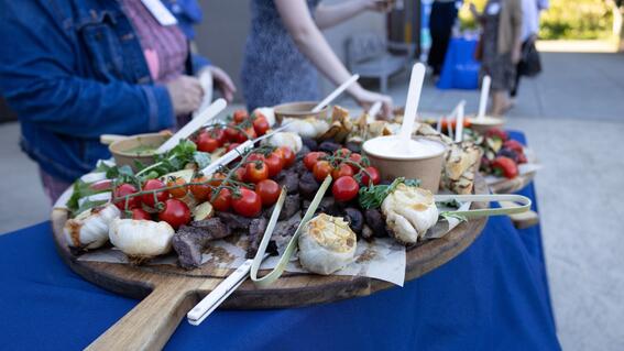 A platter of vibrant food on a blue table