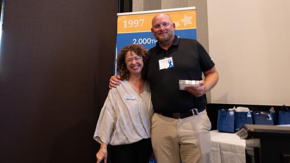 VP of Mission Delivery Susie Falk awarding Talmage Scoffield from Blueline Associates with the Wish Impact Award at the Wish Insiders South Bay.