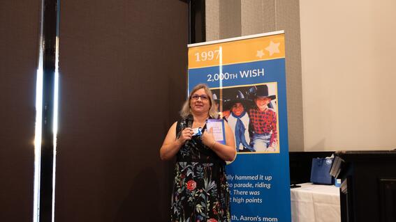 Susi Egger accepting the Wish It Forward Circle Award