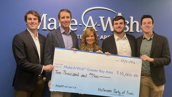 Hofmann family at Make-a-Wish Greater Bay Area office with large check