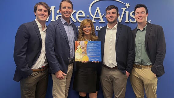 Hofmann family at Make-a-Wish Greater Bay Area office with Adopt-A-Wish Plaque