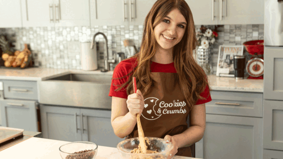 Neysa mixing dough in a bowl on her countertop