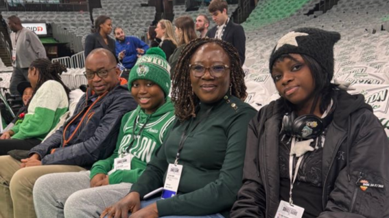 Ikenna & his family watch warmups from courtside seats