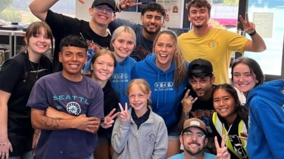 excited group of people smiling at camera 