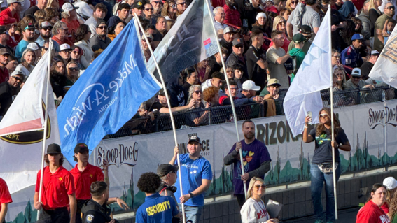 Jose Cazares, representing Make-A-Wish Arizona, proudly carried the Make-A-Wish Arizona flag across the field at the Arizona Bowl.