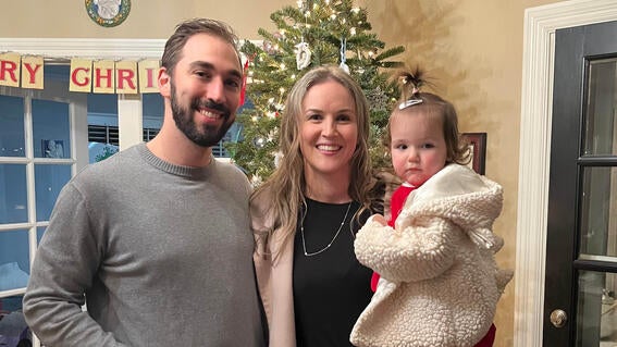 Wish alum Sarah Bechtel with her husband and daughter