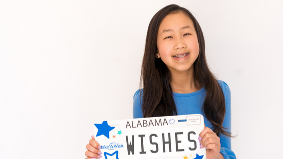 wish kid with Make-A-Wish Alabama car tag