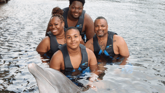 Khamari and family with dolphin