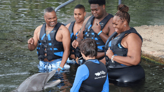 Khamari and family with dolphin
