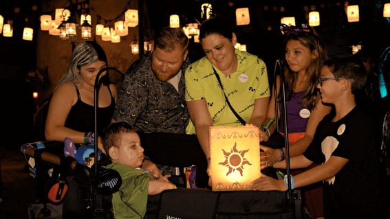 Benjamin and family lifting Tangled lantern