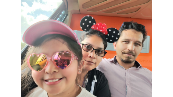Bridget takes a selfie with parents Isabel and Moises