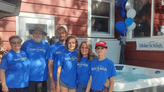 Debi and Grace's family in front of her hot tub