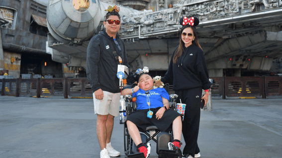 Liam and parents in front of the Milennium Falcon