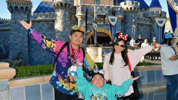 Liam and parents in front of castle