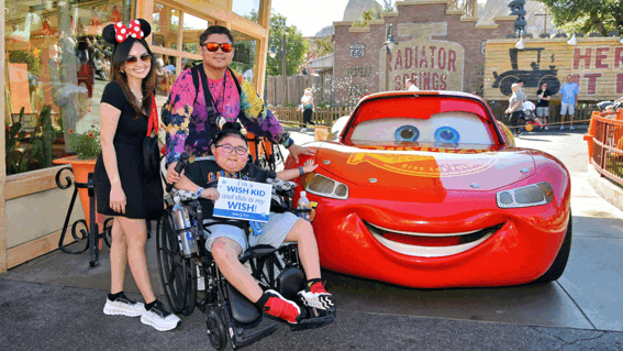 Liam and parents with Lightning McQueen