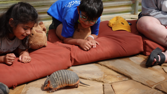 Joshua and Teresa meeting an armadillo