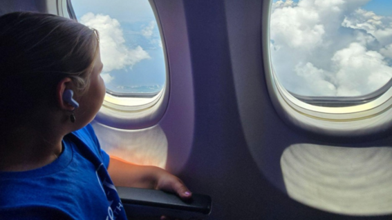 Olivia on the flight to her wish
