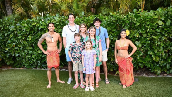 Grace and her family at Disney's Aulani Resort luau